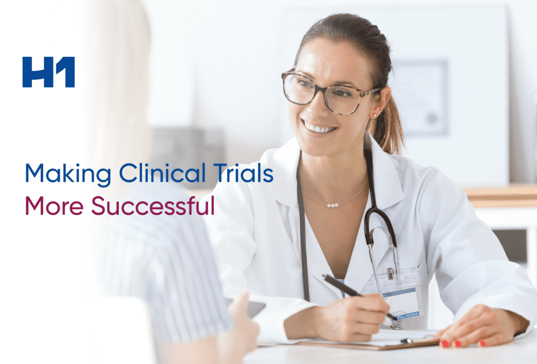 Smiling doctor writing down patient notes