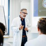 doctor talking to medical students
